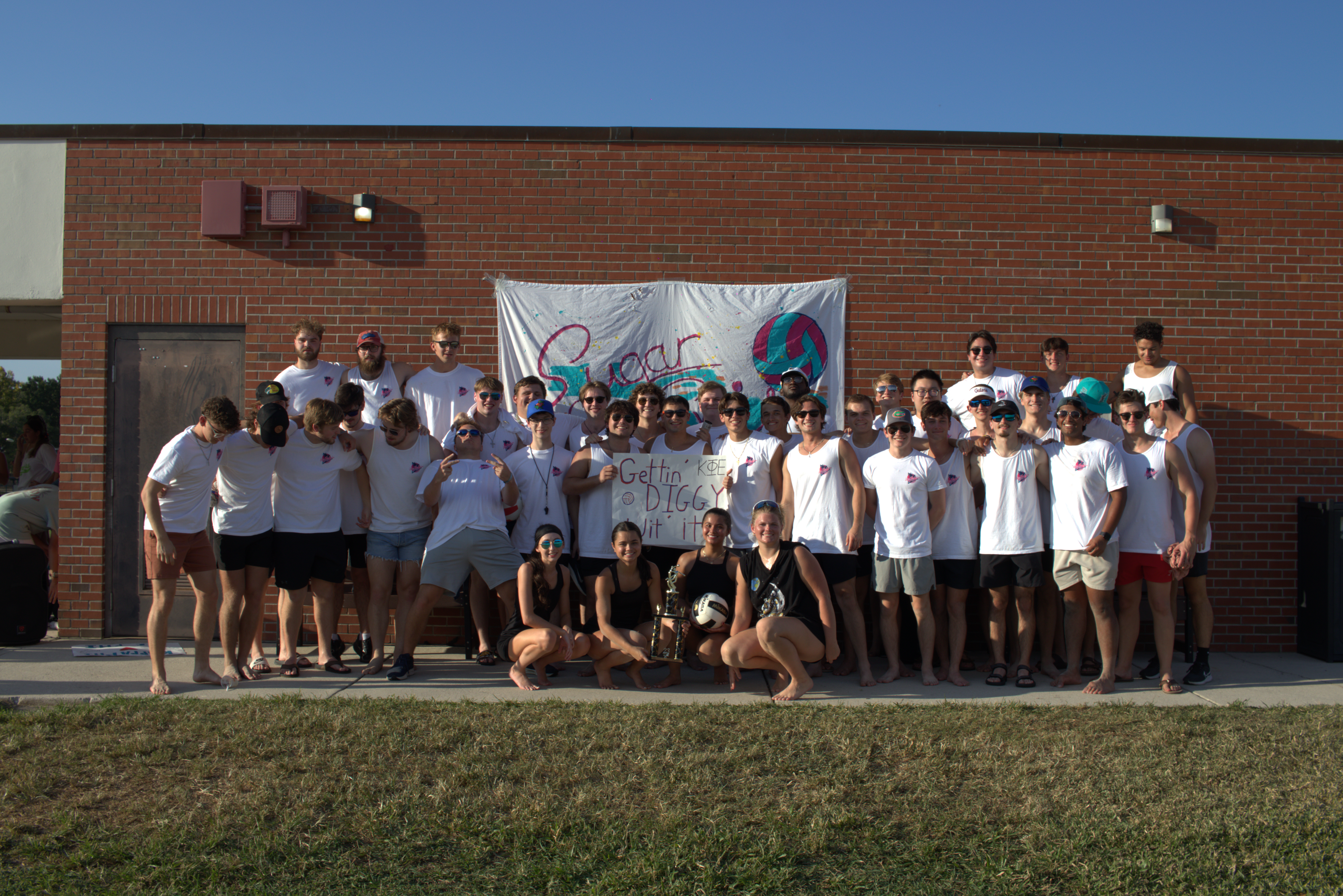 Sugar and Spike participants gathered for a group photo outside the courts
